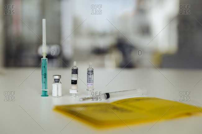 Immunization card with syringe and phials of vaccine