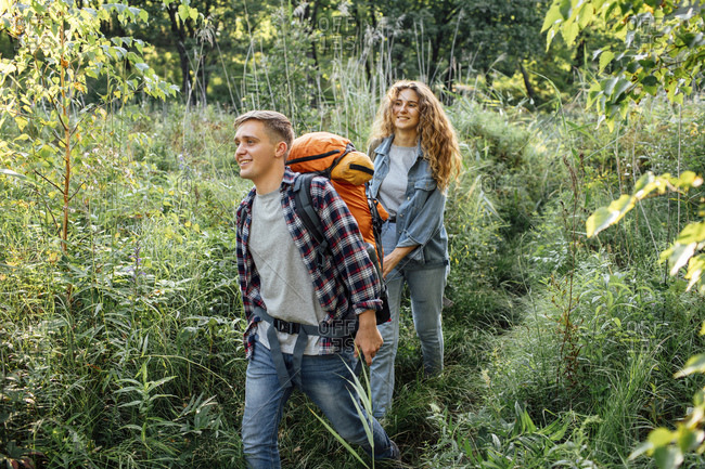 Young couple hiking nature photo - OFFSET