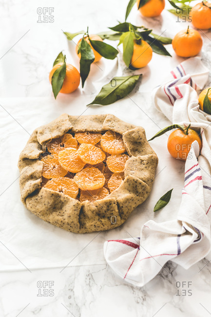 Uncooked citrus galette with clementine slices