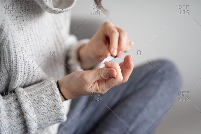 Woman filing her nails