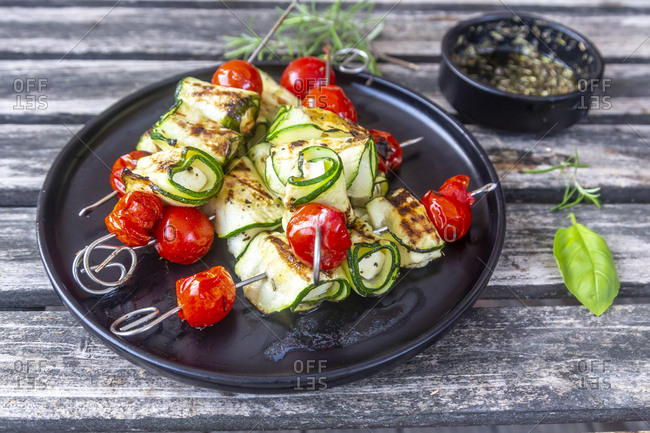 Grilled vegetarian grill skewers- tomato- sheep cheese and zucchini slices- rosemary garlic oil