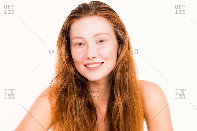 Portrait of a smiling woman with long red hair