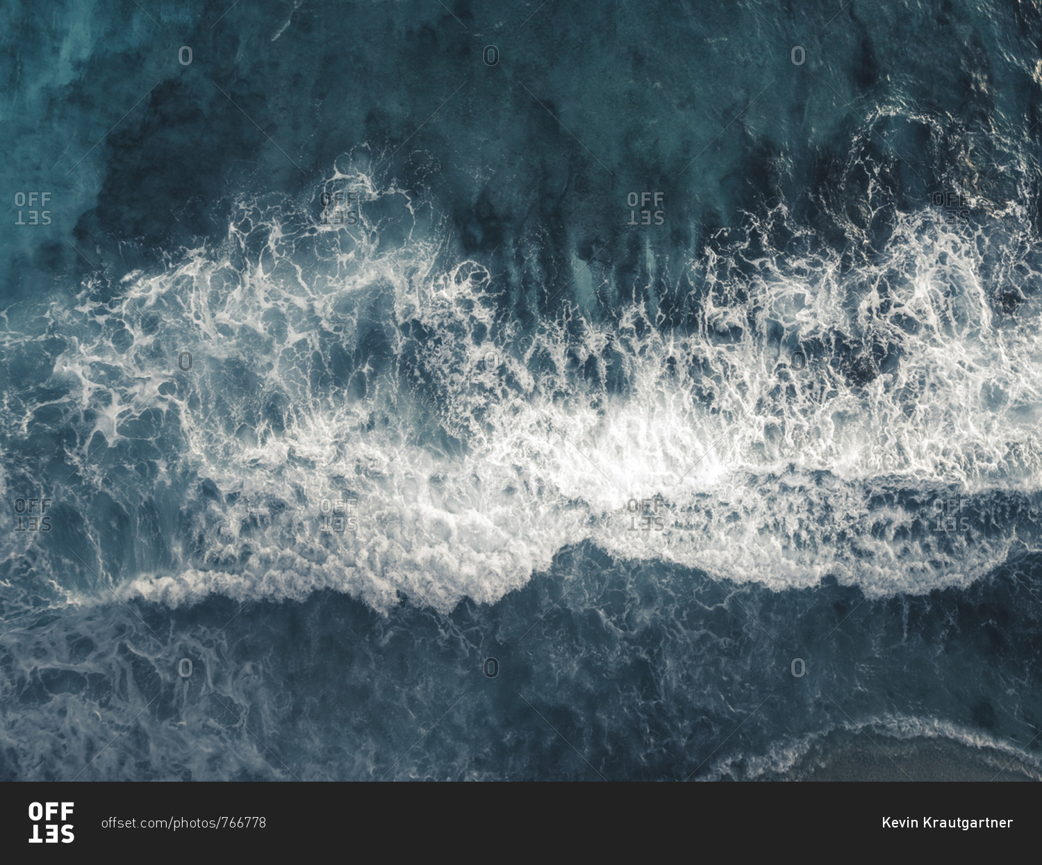 Bird\'s eye view of waves splashing in the ocean