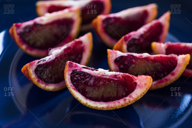 Juicy blood orange slices on plate