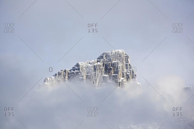Mountain peak surrounded by morning mist