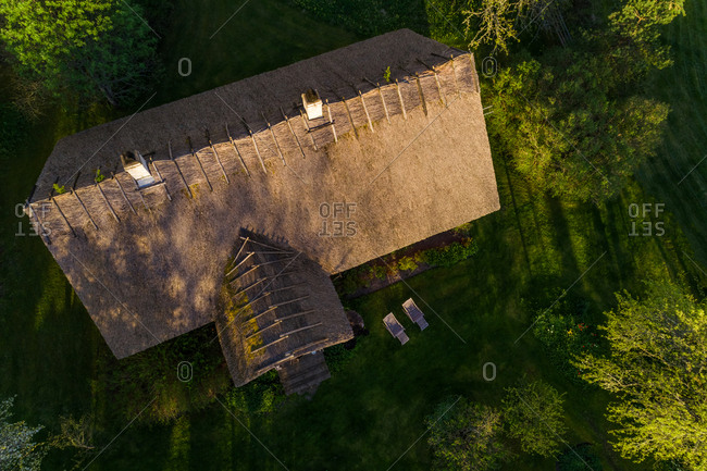 Aerial view house with thatching roof, Forby on Vormsi island, Estonia.