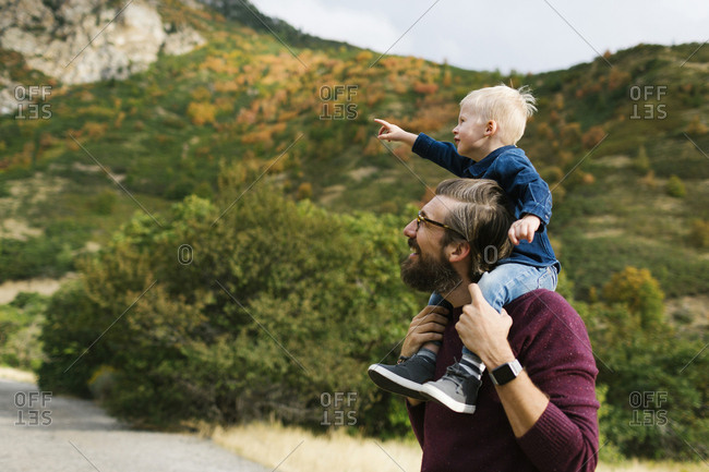 Father giving son piggyback ride