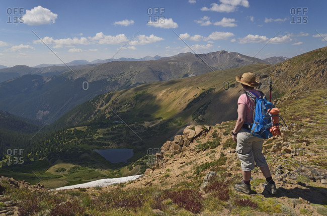 Woman looking at view while hiking on Mount Flora, Colorado