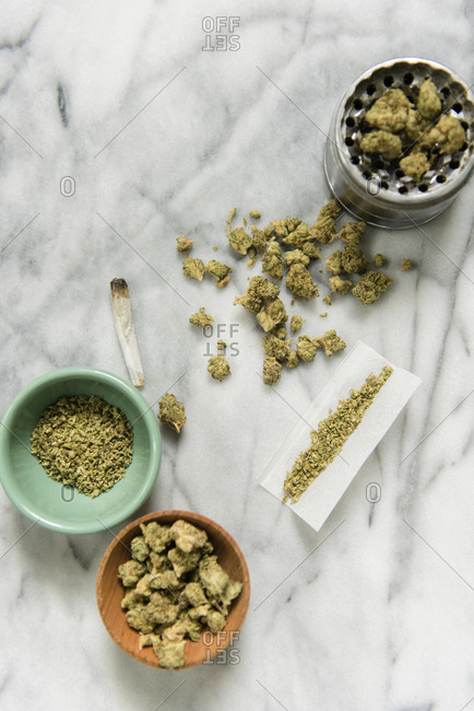 Marijuana with bowl, grinder, and rolling paper