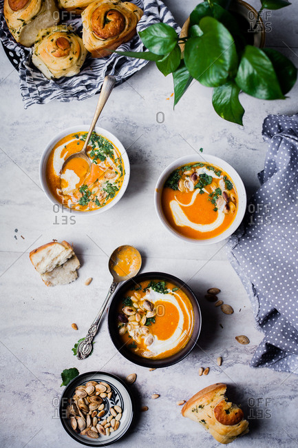 Pumpkin soup served with homemade baked bread