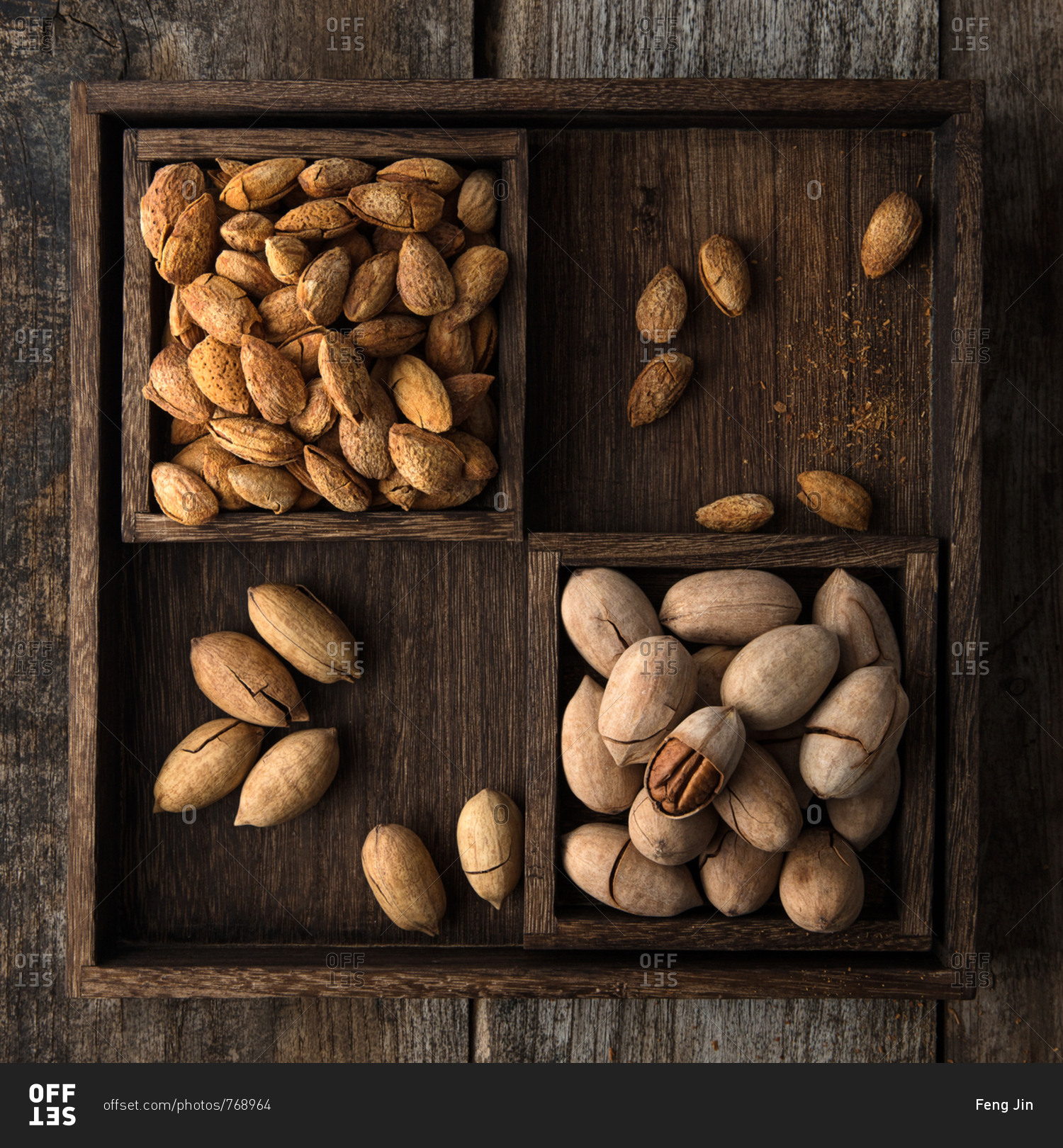 Whole nuts in rustic wooden boxes