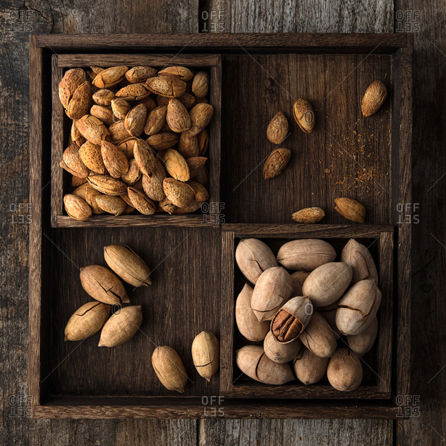 Whole nuts in rustic wooden boxes