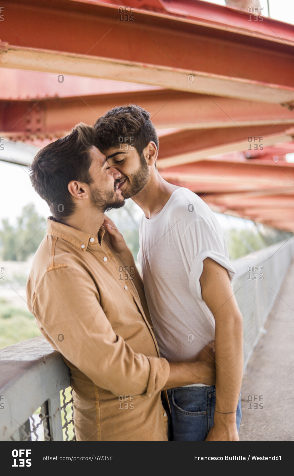 Young gay couple in love stock photo - OFFSET