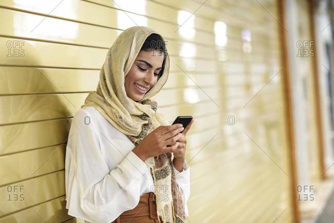 Premium Photo  Middle eastern manager lady using smartphone