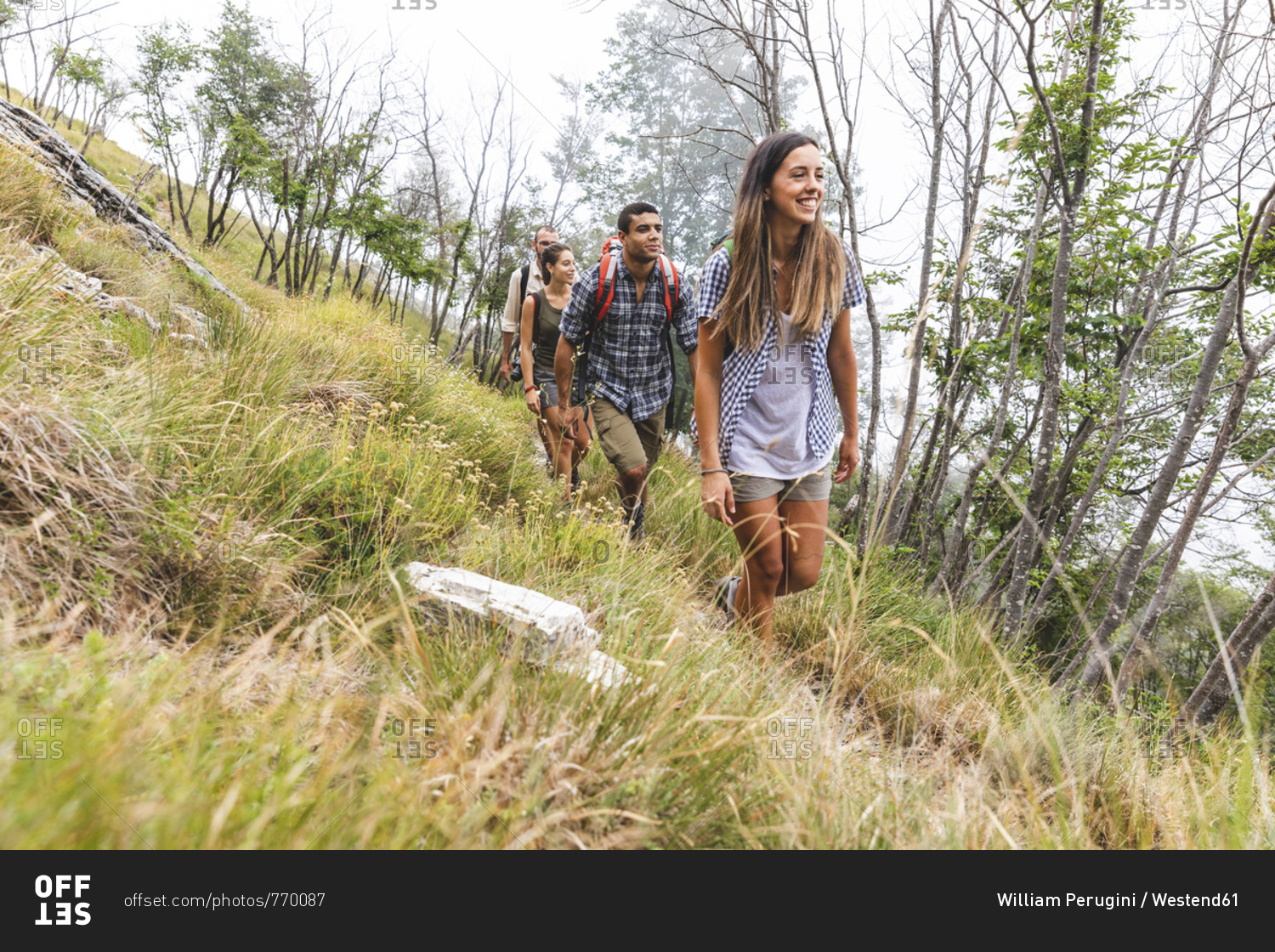 Italy- Massa- group of young people hiking in the Alpi Apuane mountains