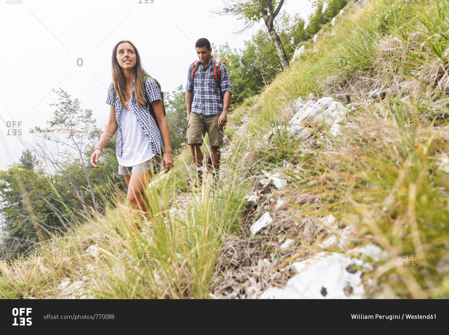Italy- Massa- young couple hiking in the Alpi Apuane mountains