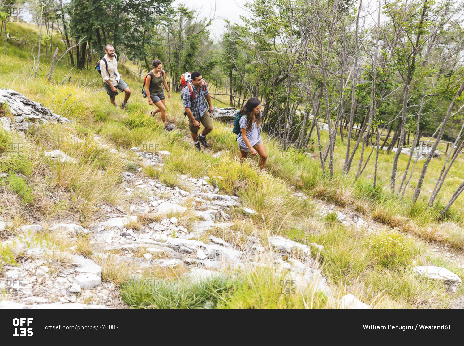 Italy- Massa- group of young people hiking in the Alpi Apuane mountains