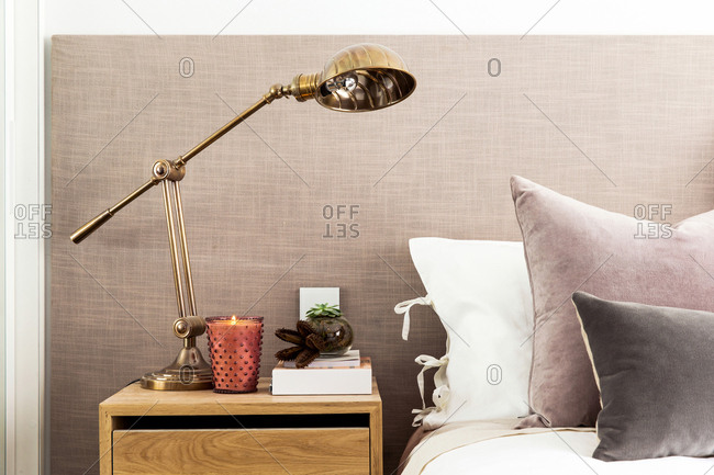 Nightstand with bronze lamp