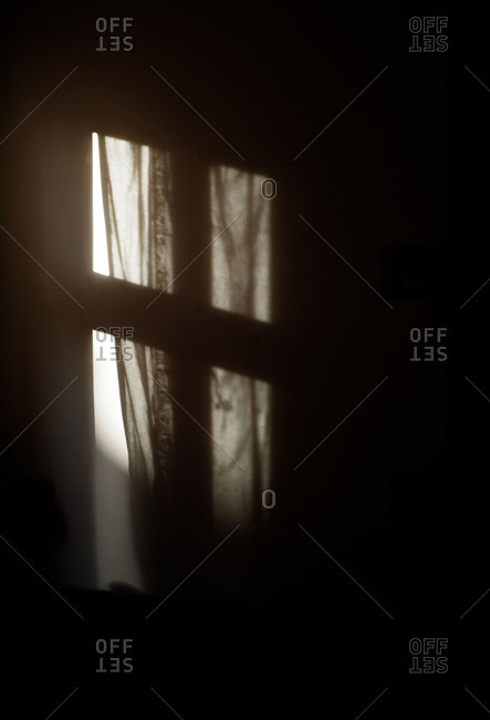 Long exposure of soft light pouring into a dark room
