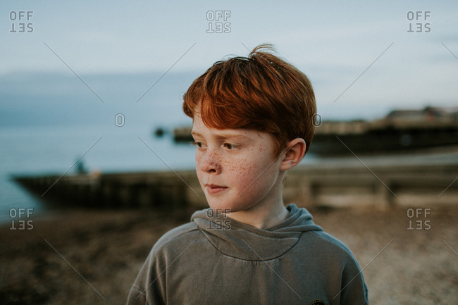 Portrait of a red-haired tween with freckles