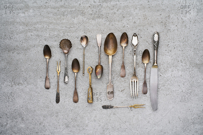 Vintage silverware on concrete background