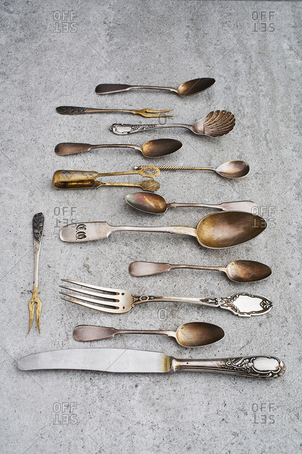 Antique silverware on gray background