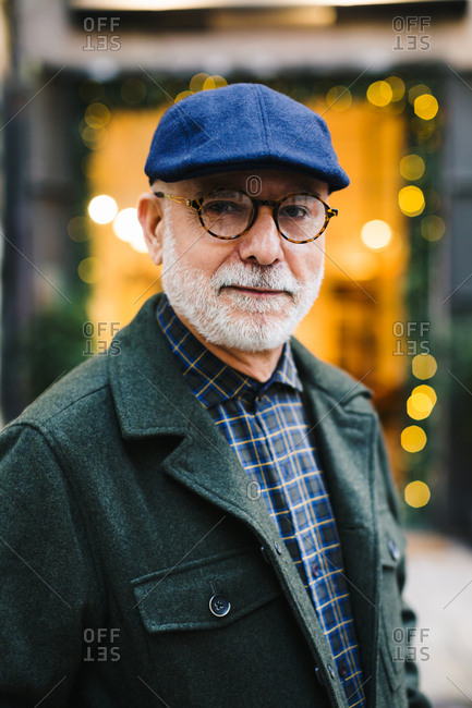 Portrait of a senior man wearing beret in the city.
