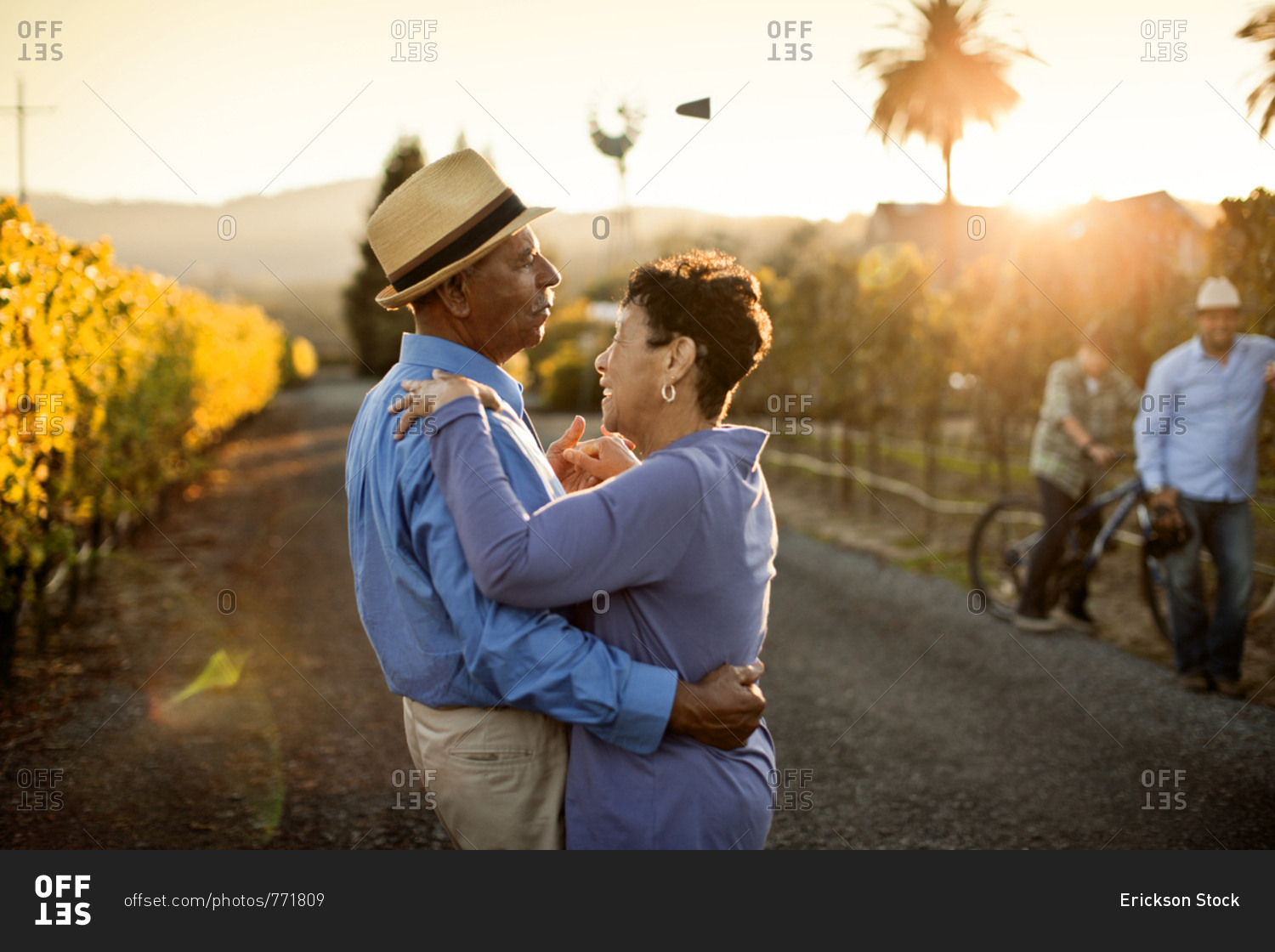 Senior couple dancing in the vineyard.