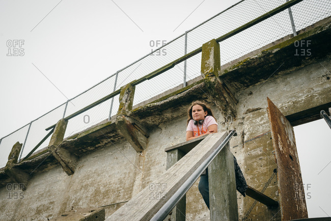 Girl standing at top of structure