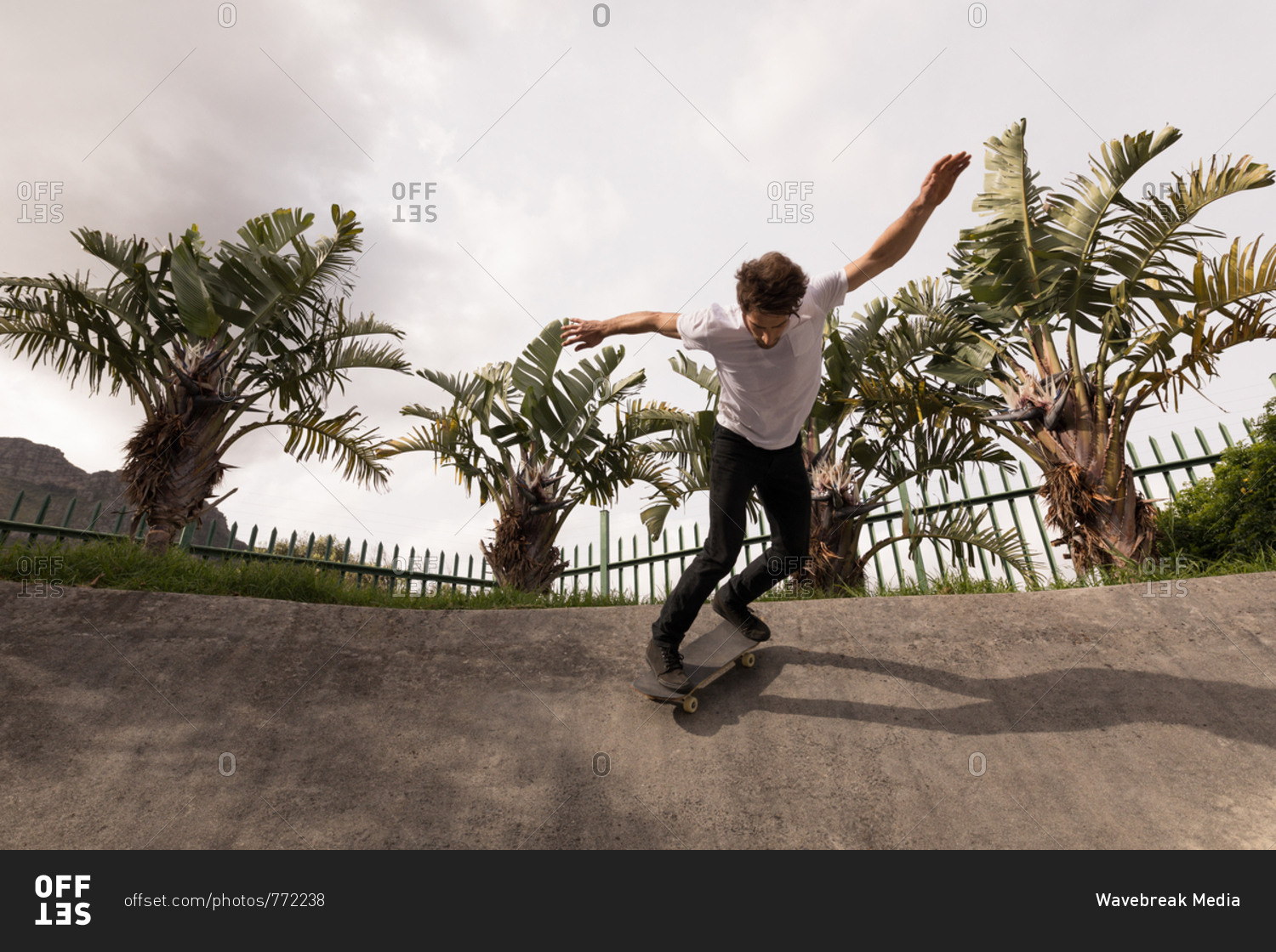 Low angle view of man skateboarding in skateboard park