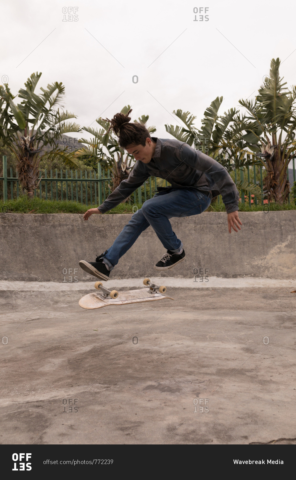 Young man skateboarding in skateboard park