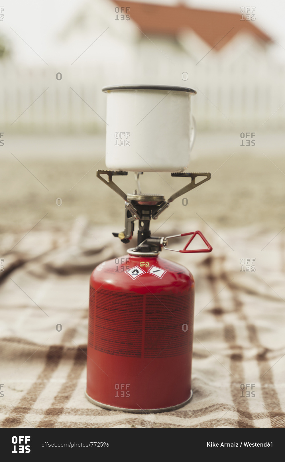 Cup of coffee boiling on a camping stove