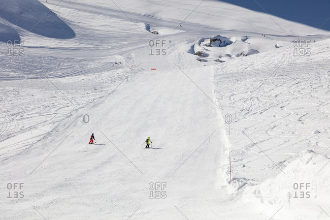 Senior couple skiing downhill - Offset