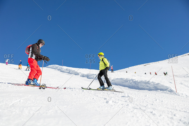Mature couple skiing in the mountains