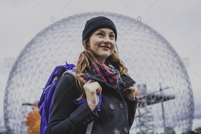 Solo woman traveller exploring landmark during autumn, Montreal, Quebec, Canada