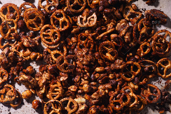 Overhead macro image of caramelized and spicy nut and mini-pretzel mix. Beer snack