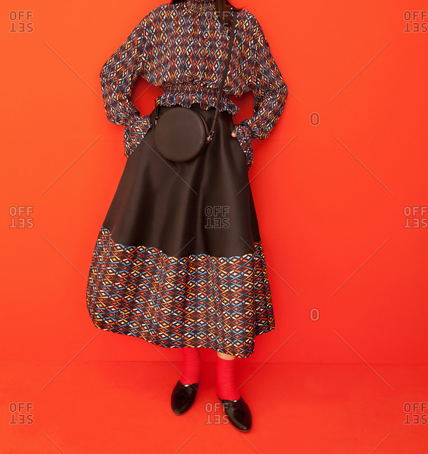 Model wearing colorful pattern skirt and shirt
