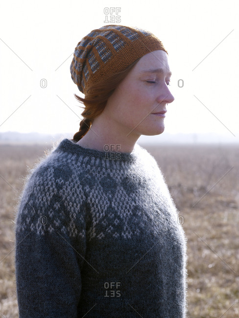 Woman wearing wooly hat and sweater