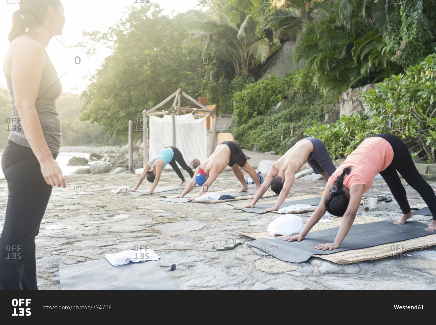 Mexico- Mismaloya- instructor with yoga class at ocean front