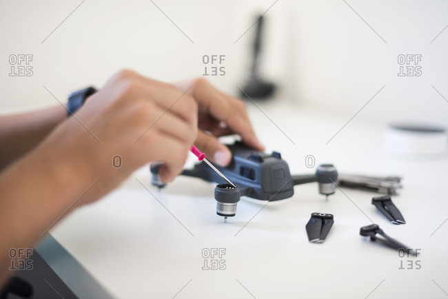 Boy repairing drone