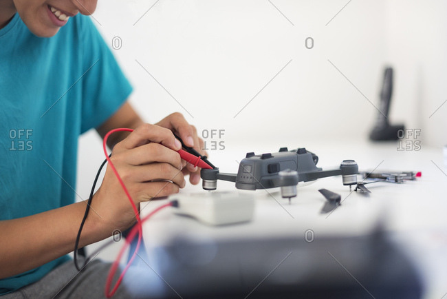 Boy repairing drone