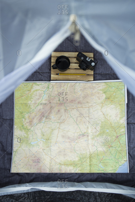 View into a tent with map- camera and