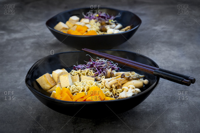 Miso Ramen soup with noodles- hokaido pumpkin- red radish sprouts- fried tofu- shimeji mushroom and king trumpet mushroom