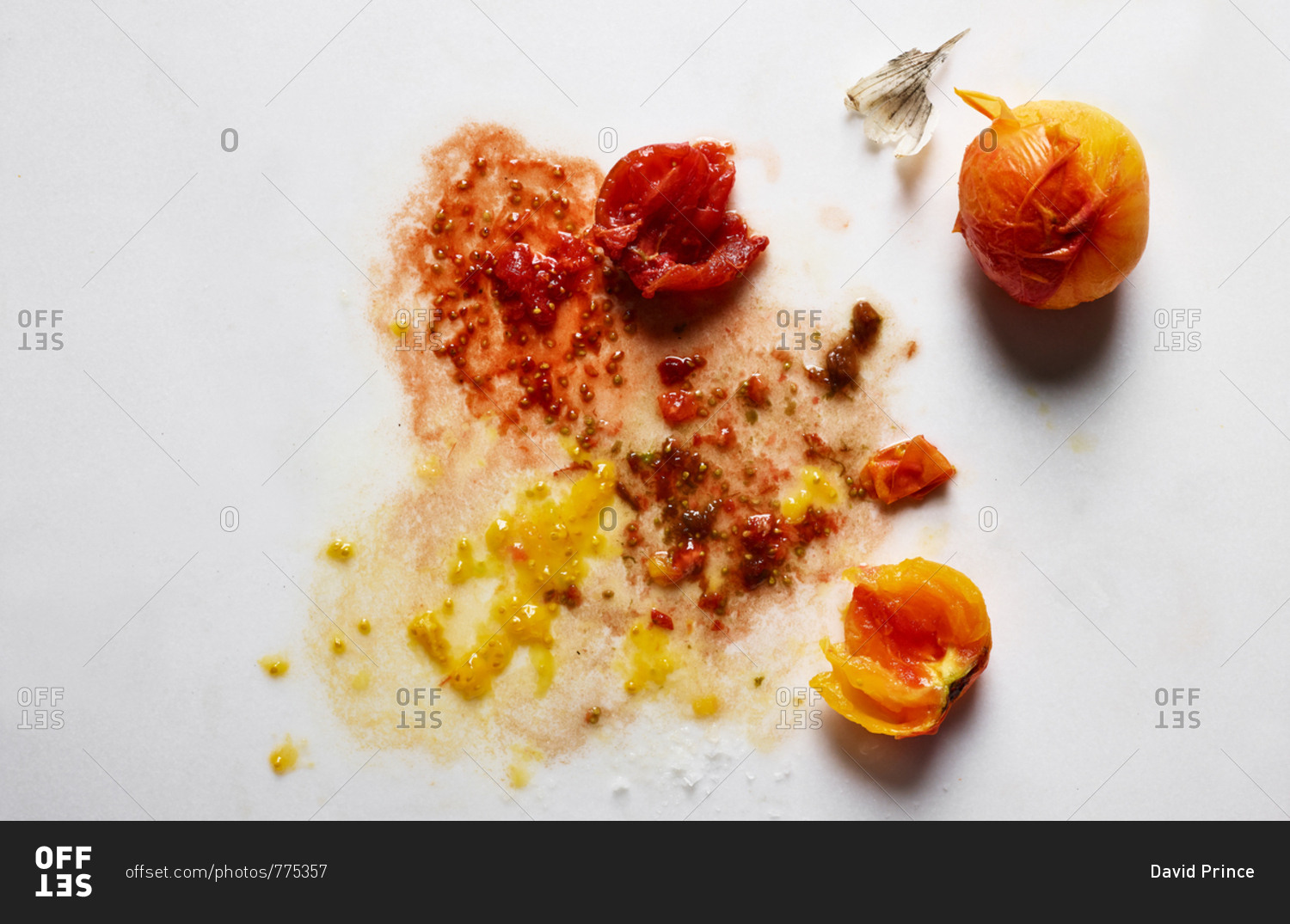 Messy red and yellow tomatoes on white background