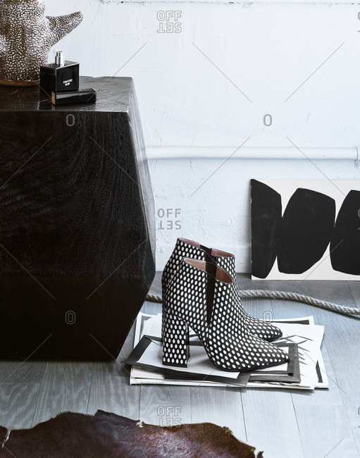 December 21, 2017 - Designer high-heeled boots and a bottle of Tom Ford Noir fragrance