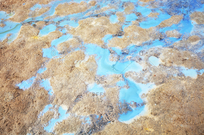 rainwater stained blue with volcanic minerals at Hverir, Myvatn, Iceland.