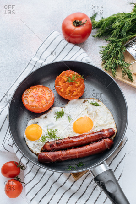 Overhead view of frying pan and cooked breakfast
