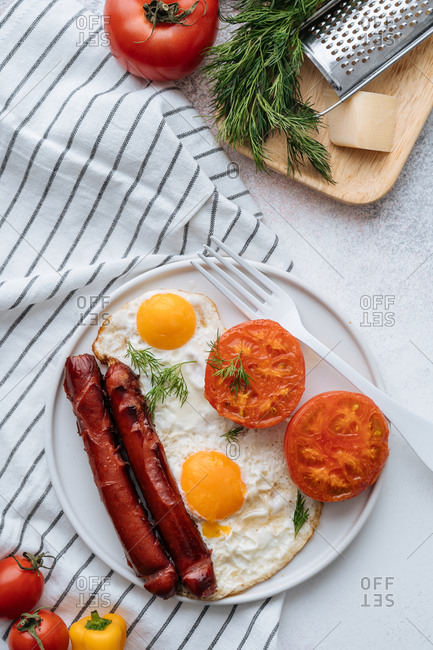 Overhead view of a plate of cooked breakfast food