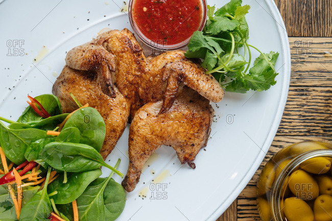 Close up of cooked chicken and salad