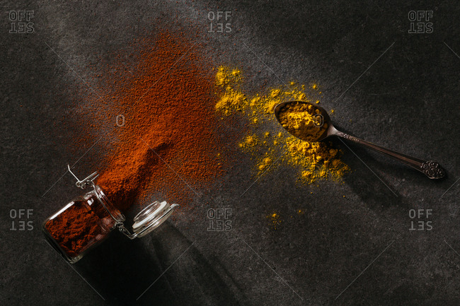 Spilled dark orange and yellow spices